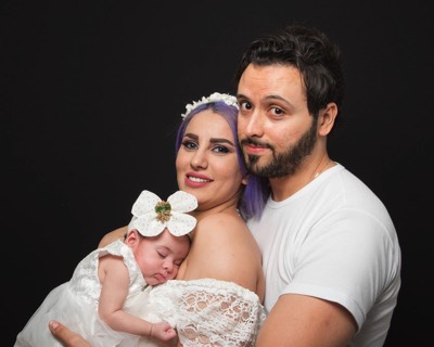  couple with newborn in studio 