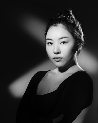  Black and white woman portrait in studio with continous lights 