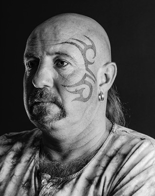 tatoo on the face protrait black and white in studio 