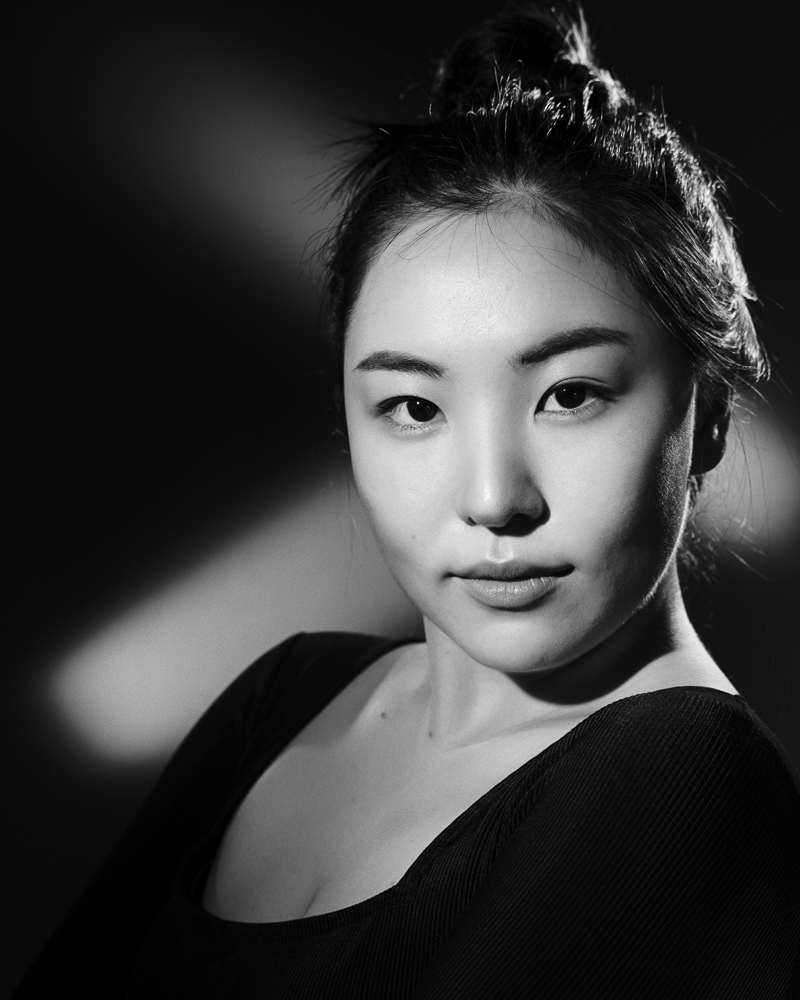  Black and white woman portrait in studio with continous lights 