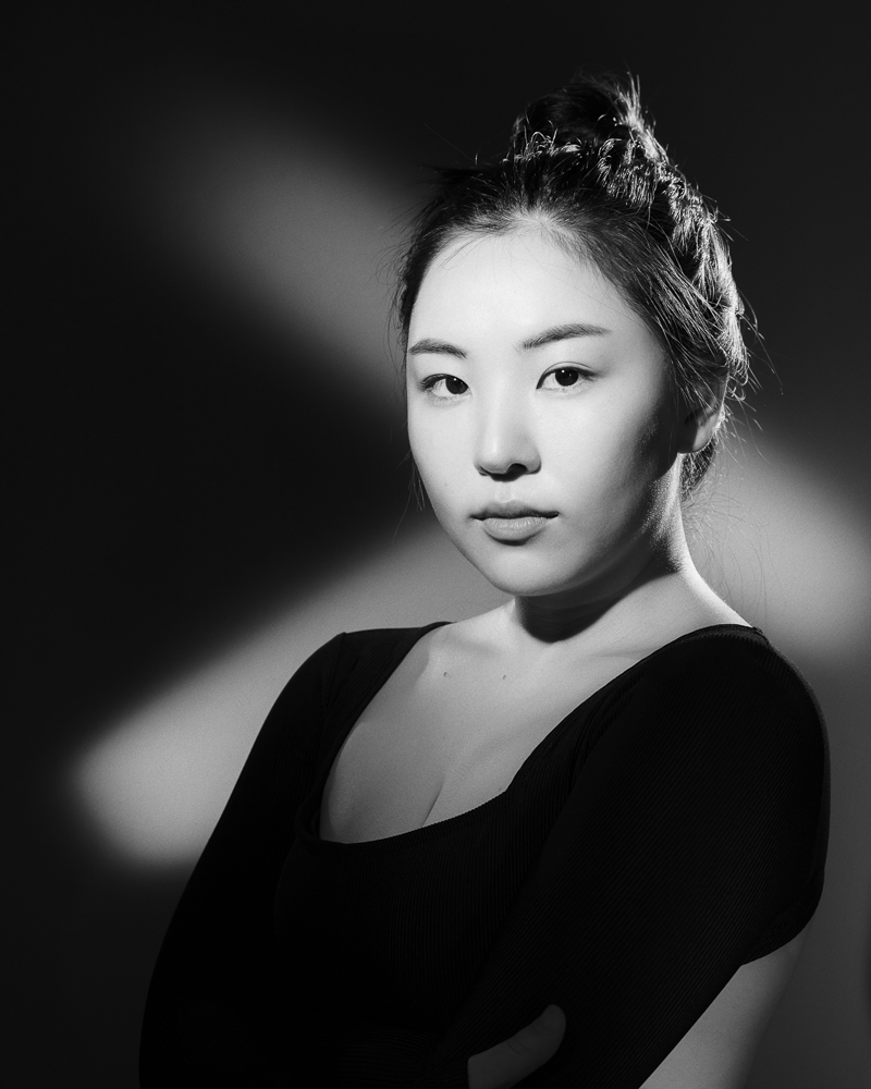  Black and white woman portrait in studio with continous lights 